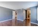Bedroom featuring hardwood floors and access to the kitchen and bathroom at 14204 E 1St Dr # A12, Aurora, CO 80011