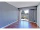 Bright bedroom features wood floors and a sliding glass door to a private balcony at 14204 E 1St Dr # A12, Aurora, CO 80011