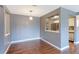 Dining area with hardwood floors and view into the kitchen with stainless-steel appliances at 14204 E 1St Dr # A12, Aurora, CO 80011