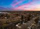 Aerial view of a residential neighborhood showcasing the beautiful sky, homes, and landscape at 3565 S Holly St, Denver, CO 80237