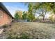 Spacious backyard with a storage shed and a privacy fence at 3565 S Holly St, Denver, CO 80237