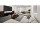 Finished basement with entertainment center, comfortable seating, and recessed lighting at 3565 S Holly St, Denver, CO 80237