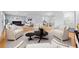 Elegant living space with hardwood floors, neutral tones, a fireplace, and an open floor plan at 3565 S Holly St, Denver, CO 80237