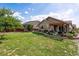 Spacious backyard featuring a lush lawn, wooden fence, and patio with pergola for outdoor entertaining at 10288 Olathe Way, Commerce City, CO 80022