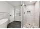 Contemporary bathroom boasting a luxurious soaking tub, glass enclosed shower and tile floors at 10288 Olathe Way, Commerce City, CO 80022