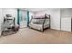 Bedroom with a bunk bed set and a fitness machine at 10288 Olathe Way, Commerce City, CO 80022