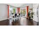 Bright dining area with large windows offering a view of the outdoor patio and well-lit backyard at 10288 Olathe Way, Commerce City, CO 80022