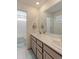 Elegant bathroom with double sinks and marble countertops at 10983 Uvalda St, Commerce City, CO 80022