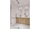 Modern bathroom with double vanity and glass shower at 4642 Tennyson St # 26, Denver, CO 80211