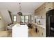 Modern kitchen with light wood cabinets and a large island at 4642 Tennyson St # 26, Denver, CO 80211