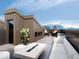 Relaxing rooftop deck with seating, fire pit and mountain views at 4642 Tennyson St # 26, Denver, CO 80211