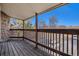 Inviting outdoor balcony overlooking the parking area, with sturdy wooden railing and stone accents at 3412 S Eagle St # 202, Aurora, CO 80014