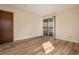 Bedroom with wood-look floors and sliding glass doors at 3412 S Eagle St # 202, Aurora, CO 80014