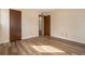 Clean bedroom design with wood-look flooring and neutral walls at 3412 S Eagle St # 202, Aurora, CO 80014