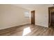 Neutral bedroom with wood-look floors and natural light at 3412 S Eagle St # 202, Aurora, CO 80014