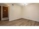 Well-lit dining area showing the wood-look floor and a closet at 3412 S Eagle St # 202, Aurora, CO 80014