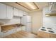 Bright kitchen with white appliances, wooden countertops, and ample cabinet space at 3412 S Eagle St # 202, Aurora, CO 80014