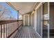 Relaxing outdoor patio area with sliding glass doors, railing, and ample space for seating and lounging at 3412 S Eagle St # 202, Aurora, CO 80014