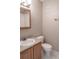 Small bathroom with oak vanity and shower over tub at 12158 W Dorado Pl # 204, Littleton, CO 80127