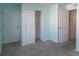 Bedroom with carpeting and dual closets; one closet with sliding doors at 12158 W Dorado Pl # 204, Littleton, CO 80127