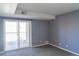 Bedroom with carpet and sliding glass door to balcony at 12158 W Dorado Pl # 204, Littleton, CO 80127