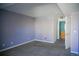 A spacious bedroom featuring neutral carpeting and a walk-in closet at 12158 W Dorado Pl # 204, Littleton, CO 80127