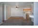 Open-concept living room area with neutral paint, plush carpet, and a ceiling fan at 12158 W Dorado Pl # 204, Littleton, CO 80127