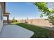 Spacious backyard with lush green lawn and a privacy fence at 27957 E 9Th Dr, Aurora, CO 80018