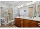 Modern bathroom with double vanity, walk-in shower, and sleek fixtures at 27957 E 9Th Dr, Aurora, CO 80018