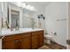Bright bathroom features double sink vanity, white countertops and decorative artwork at 27957 E 9Th Dr, Aurora, CO 80018