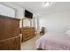 Cozy bedroom features a comfortable bed, dresser, and soft natural lighting at 27957 E 9Th Dr, Aurora, CO 80018