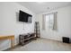 Bedroom features a large window and a mounted television at 27957 E 9Th Dr, Aurora, CO 80018