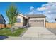 Charming single-Gathering home with a well-manicured lawn and attached two-car garage at 27957 E 9Th Dr, Aurora, CO 80018