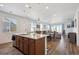 Spacious open kitchen with island seating, modern fixtures, and ample counter space at 27957 E 9Th Dr, Aurora, CO 80018