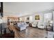 Spacious living room featuring hardwood floors, ample natural light, and modern decor at 27957 E 9Th Dr, Aurora, CO 80018