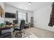Functional office space with a large window and neutral decor at 27957 E 9Th Dr, Aurora, CO 80018