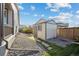 Backyard features a functional storage shed at 27957 E 9Th Dr, Aurora, CO 80018