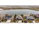 Aerial shot of a neighborhood with waterfront homes, featuring well-kept lawns and mature trees at 1738 Edgewater Pl, Longmont, CO 80504