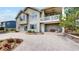 Two-story home with a spacious backyard featuring a concrete patio, a swing, and mature landscaping at 1738 Edgewater Pl, Longmont, CO 80504