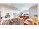 Finished basement providing a desk, chair, cabinet, and large oriental rug at 1738 Edgewater Pl, Longmont, CO 80504