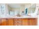 Bathroom with double sink vanity, granite countertops, and neutral decor at 1738 Edgewater Pl, Longmont, CO 80504
