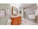 Bright bathroom with a glass shower, vanity with granite top, and tile floors at 1738 Edgewater Pl, Longmont, CO 80504