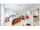 Floral bedroom with a bed, dresser, adjacent bathroom, and access to the main part of the house at 1738 Edgewater Pl, Longmont, CO 80504