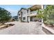 Back exterior of a two-story home featuring a large patio and second story porch at 1738 Edgewater Pl, Longmont, CO 80504