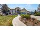 Beautifully landscaped front yard with a curved walkway leading to the home at 1738 Edgewater Pl, Longmont, CO 80504