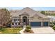 Charming single-Gathering home featuring stone accents, a well-manicured lawn, and a two-car garage at 1738 Edgewater Pl, Longmont, CO 80504