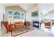 Bright living room with fireplace, vaulted ceilings, and large windows at 1738 Edgewater Pl, Longmont, CO 80504