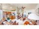Open-concept living room with fireplace and seamless transition to the kitchen at 1738 Edgewater Pl, Longmont, CO 80504
