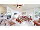 Comfortable living room with fireplace, large windows, and classic decor at 1738 Edgewater Pl, Longmont, CO 80504