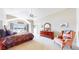 Main bedroom with tray ceilings, neutral carpeting, and waterfront views at 1738 Edgewater Pl, Longmont, CO 80504
